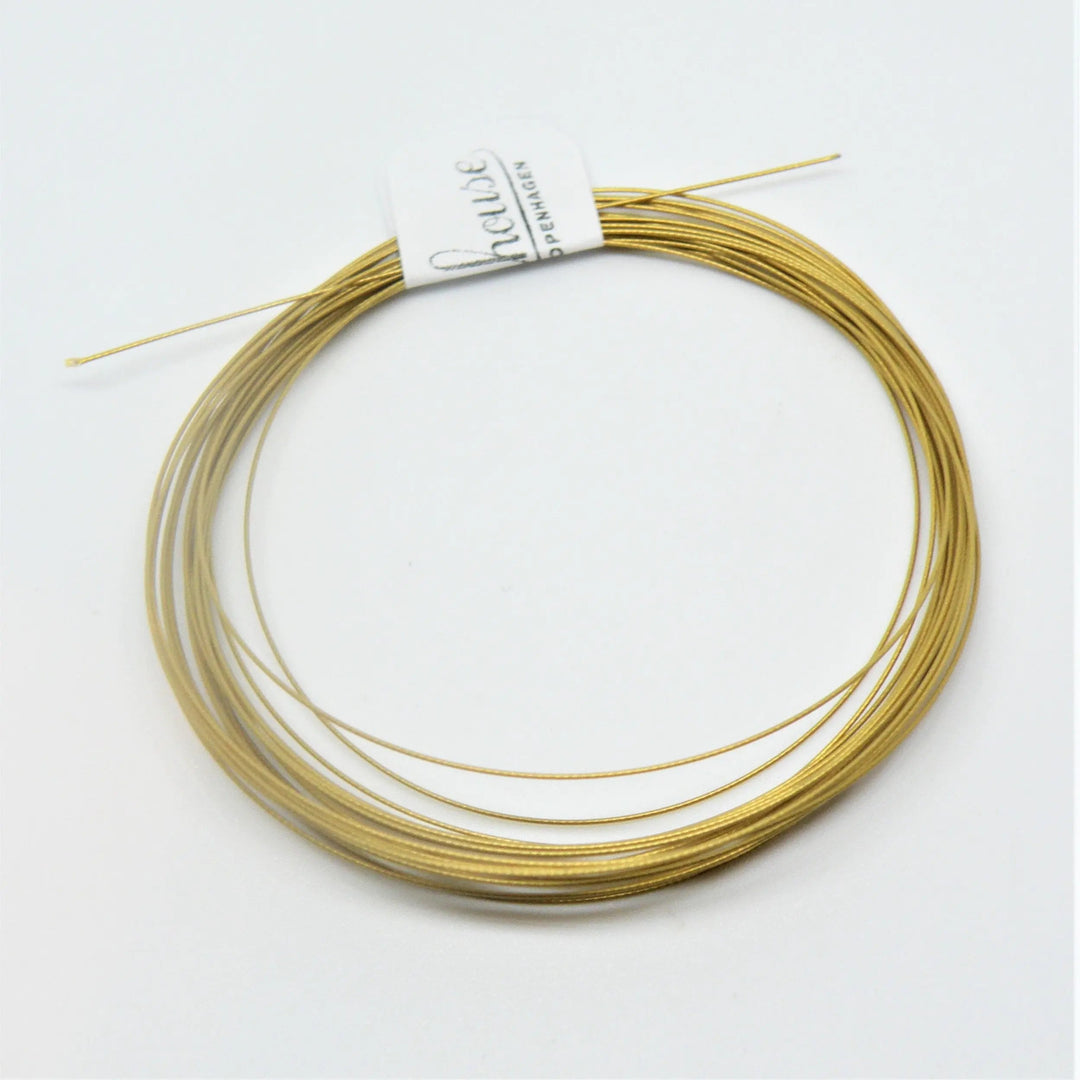 Tigerwire, japansk lys guld, stål, 0,32 mm Tax