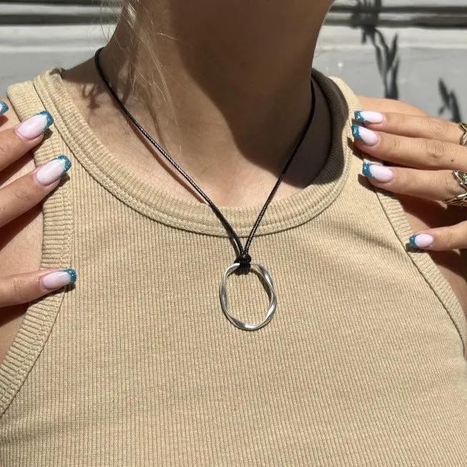 Vedhæng, twisted oval, forgyldt og forsølvet zamak Greece