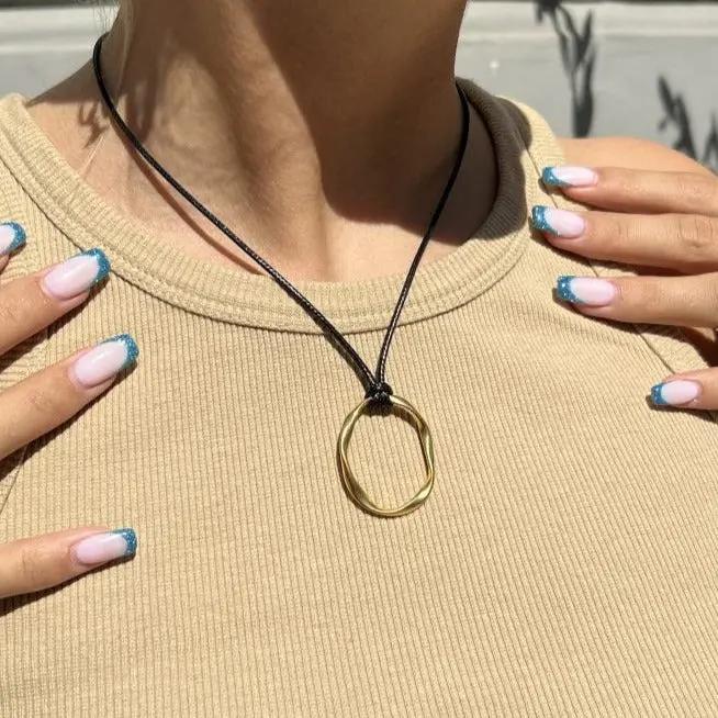 Vedhæng, twisted oval, forgyldt og forsølvet zamak Greece